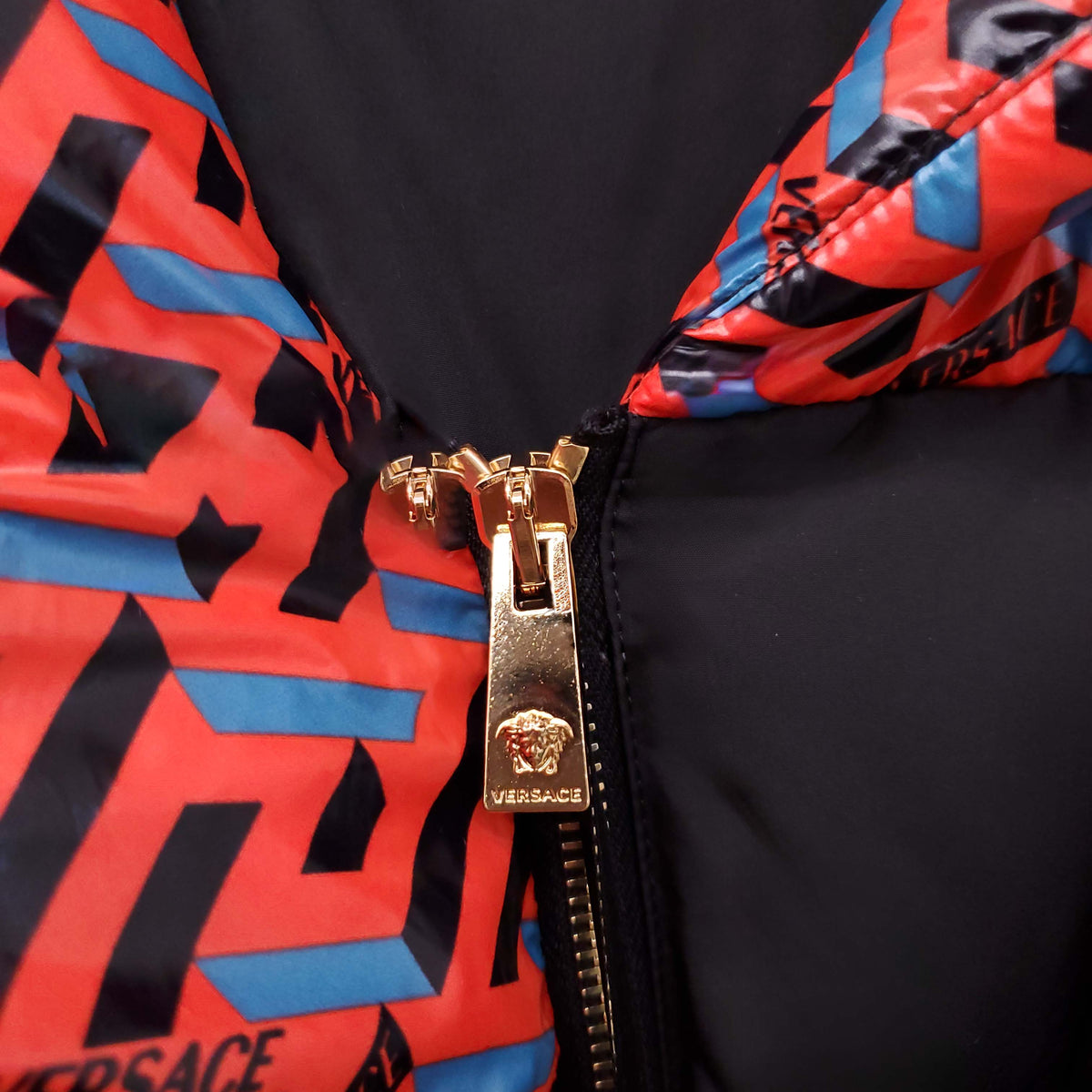 VERSACE BLACK, RED AND BLUE PATTERNED LOGO PUFFER JACKET WITH MEDUSA BUTTONS - SIZE 42