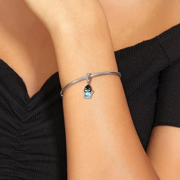 Penguin with a Glowing Blue Sphere Dangle Charm